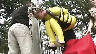 MILF Submits To Be Bound And Hanged As A Flag Outdoors